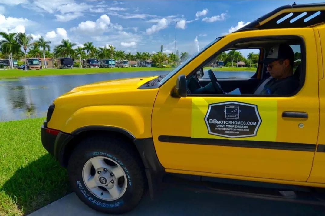 BB Motorhomes branded yellow service truck at a Florida RV resort