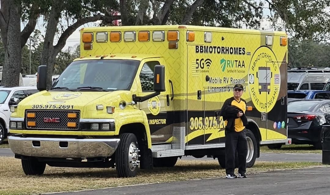 BB Motorhomes yellow mobile RV service vehicle and technician